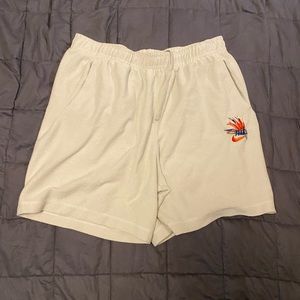 Nike Tan shorts with colorful logo